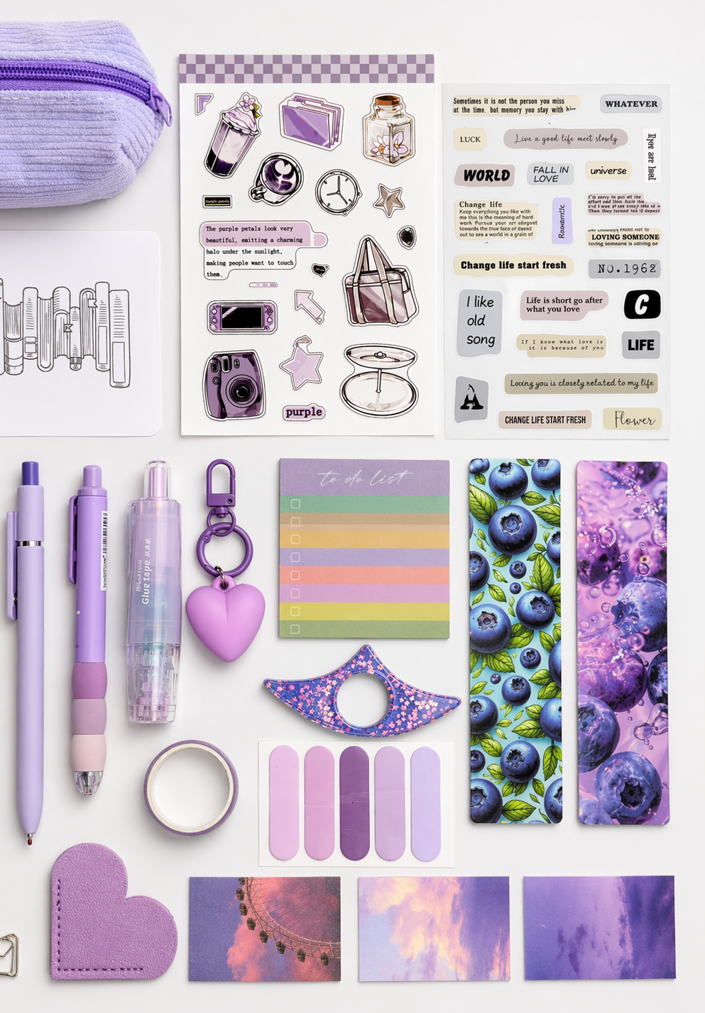 Collection of stationery items including pens, stickers, and a pouch with a purple theme.