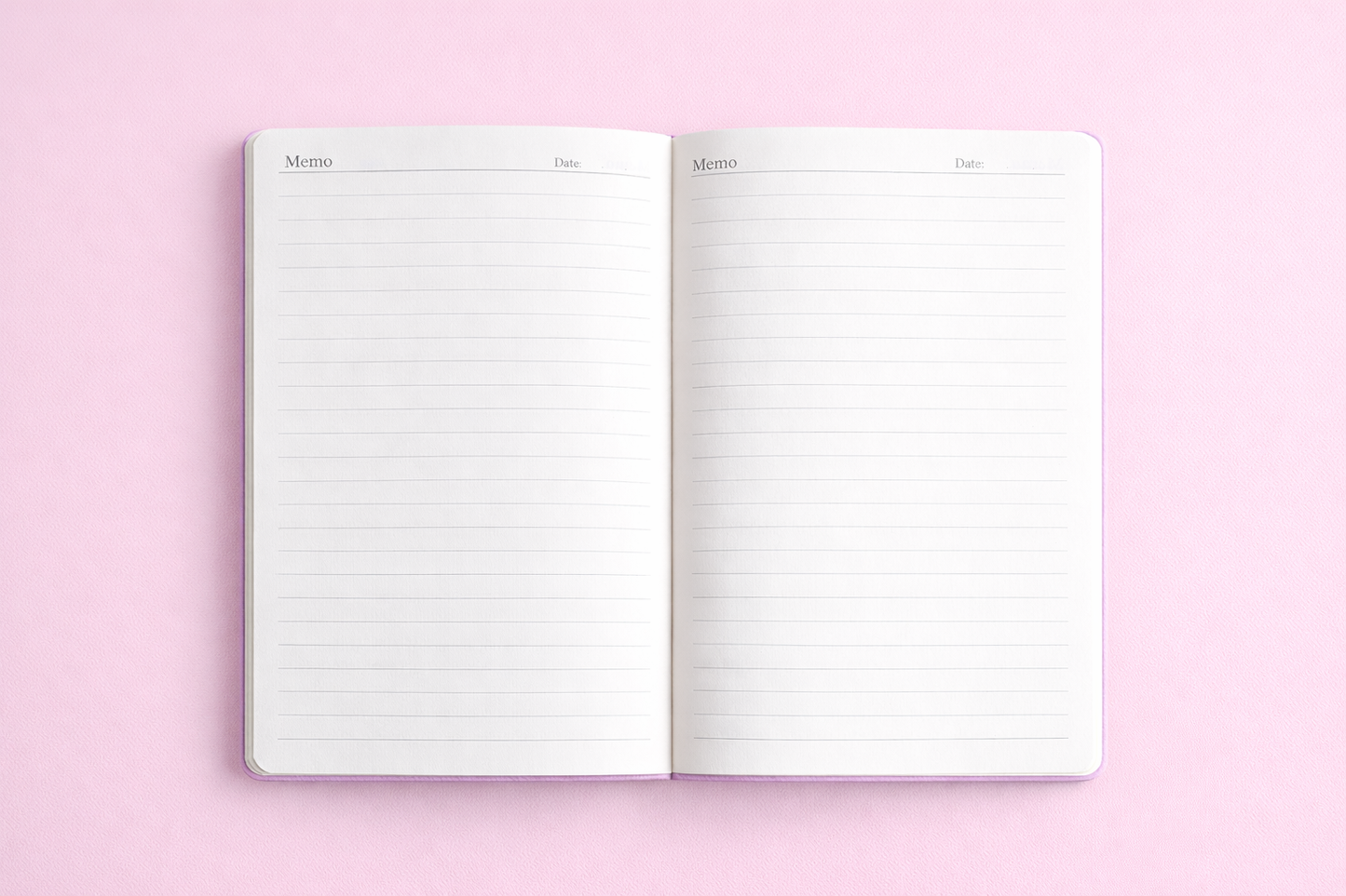 Open notebook with lined pages on a pink background